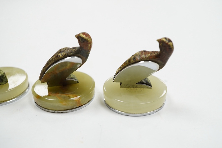 A cased Asprey set of four cold painted bronze and chrome plated novelty game bird menu holders, tallest 5cm high. Condition - good